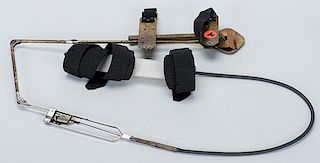 Kepplinger Holdout Device. American, ca. 1910. A knee spread device that straps to the knees and arm and when the knees are spread apart delivers a ca
