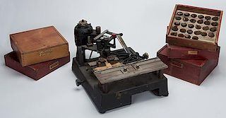 Dice Stamping Machine and Five Boxes of Metal Stamping Dies. New Hermes, N.Y., ca. 1940. This machine was used to stamp the name of the casino or club