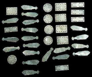 Group of 33 Scrimshawed Mother of Pearl Chinese Gaming Chips. Circa 1880. Including 18 fish-shaped, five round, five long rectangular and five short r