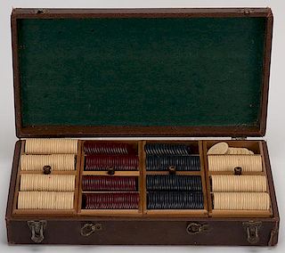 Cased Set of 371 Clay Equestrian Poker Chips. Circa 1910. Including 186 white, 94 maroon and 91 blue chips, each embossed with a horse and whip-wieldi