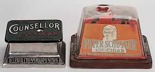 Two Advertising Brunhoff Cigar Cutters. The first a cast iron model (ca. 1900) advertising for Chancellor of Philadelphia, apparently repainted, with 