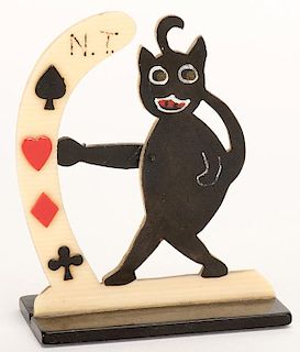 Black Cat Trump Indicator. Circa 1930. Celluloid trump indicator. Paw points to the correct suit. Excellent.