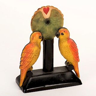 Parrot Trump Indicator. Circa 1930. Celluloid parrots with paper wheel showing suit signs. Excellent.