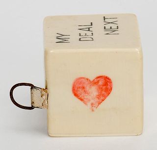 Trump Indicator Cube with Tape Measure. Germany, ca. 1930. Celluloid cube with clubs, diamonds, hearts, spades, ñno trumpî and ñmy deal nextî on s