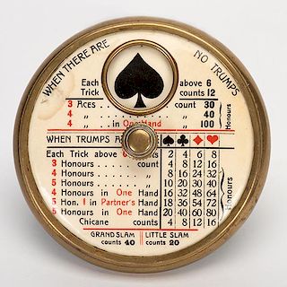 Trump Indicator. Circa 1930. Round brass trump indicator with celluloid scoring instructions on top. Excellent.