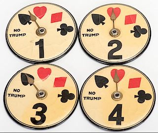 Set of Four Trump Indicators and Table Markers. Circa 1930. Celluloid faces have crackling otherwise very good.