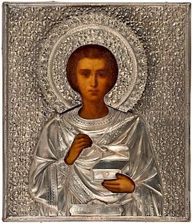 A RUSSIAN ICON OF SAINT PANTELEIMON IN A SILVER OKLAD, CYRILLIC MAKERS MARK GK, MOSCOW, LAST QUARTER OF THE 19TH CENTURY