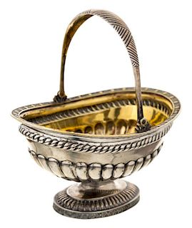 A RUSSIAN PARCEL GILT SILVER CAKE BASKET WITH SWING HANDLE, CYRILLIC MAKERS MARK A Ya, SAINT PETERSBURG, FIRST HALF OF 19TH CENTURY