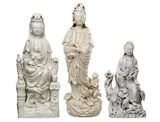 A GROUP OF THREE BLANC-DE-CHINE FIGURES OF GUANYIN