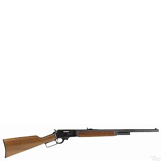 Marlin model 1895 lever action rifle, chambered in 45-70, with a blued finish and a walnut stock
