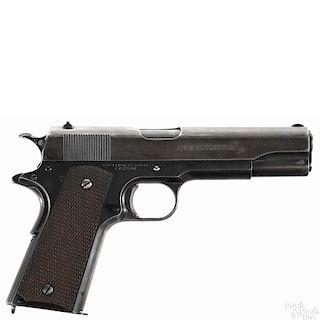 Colt model 1911 Commercial semi-automatic pistol, .45 ACP caliber, with a blued finish