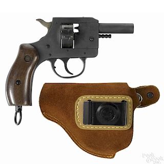 New England Firearms blank starter revolver, .22 caliber, model B22, with a holster.