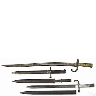 Three bayonets, to include a US model 1898 Krag bayonet with a scabbard, 11 1/2'' l.