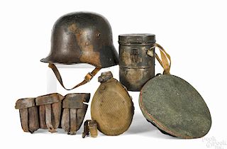 German WWI military accessories and gear, to include a camouflage helmet with pencil inscription