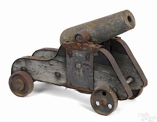 Cast iron black powder cannon with iron wheels, 18'' cannon barrel, 2 1/2'' smoothbore