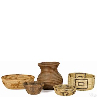Five Native American Indian baskets, one with animal figures, one with human figures