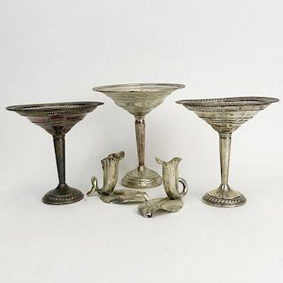Three Weighted Sterling Silver Compotes and a Pair of 900 Silver Flower Candlesticks.
