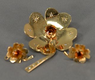 14K gold three piece lot including floral brooch and matching earrings, each mounted with citrine surrounded by diamonds, 28.2 grams.