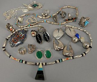Jewelry lot including 10 silver rings, 7 pairs of silver earrings, and 4 necklaces.