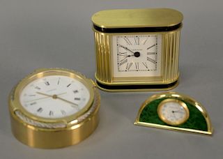 Three Verdura table or desk clocks including round nautical brass and stainless steel and a brass and black clock (tops loose), hts
