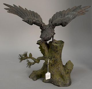 Japanese bronze bird of prey eagle figure perched on pine tree stump, signed on back