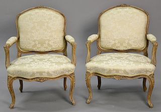 Pair of Louis XV style bergeres in clean upholstery.