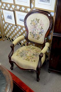 Victorian gents chair with needlepoint upholstery.