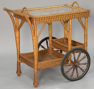 Wicker tea cart with glass tray top. ht. 31" top: 18" x 28"