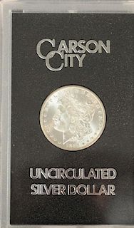 Carson City uncirculated silver dollar, 1884, in fitted wood box.