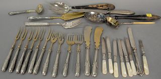 Weighted silver serving and flatware group to include Continental silver partial fish set with gold wash.