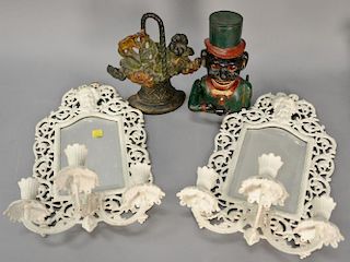 Four piece group including cast iron Jolly Bank, cast iron flower bouquet, and pair of white painted Bradley & Hubbard mirrored sconces