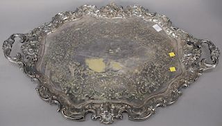 Large silverplated tray with lion head handles.