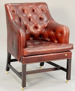 George Smith leather armchair on brass castors.