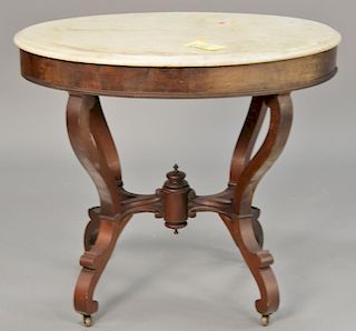 Oval Victorian marble top table. ht. 31", top: 24" x 34"