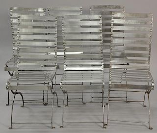 Set of six metal slat side chairs with cushions.