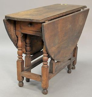 Oak gateleg drop leaf table with drawer, probably 18th century. ht. 28", top closed: 16" x 42"
