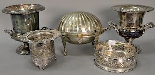 Five silverplated items to include revolving serving piece, two wine buckets, and two red wine holders (one marked Tiffany & Co
