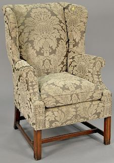 Custom upholstered Chippendale style wing chair along with a round top stand with one drawer.