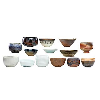 STUDIO CERAMICS Thirteen tea bowls, one saucer