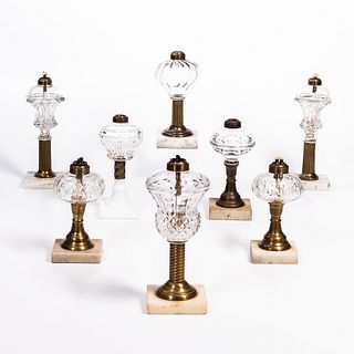 Eight Colorless Glass Lamps with Marble Bases