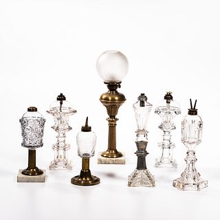 Seven Colorless and Brass Lamps