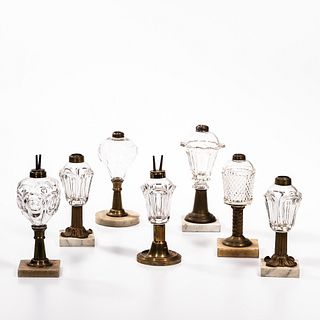 Seven Colorless Pattern Glass and Brass Lamps