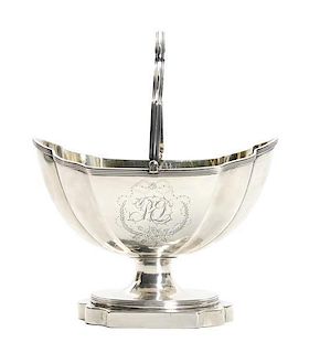 A George III Silver Sugar Basket, Henry Chawney, London, 1795, of lobed, footed form, surmounted by a swing handle, engraved wit