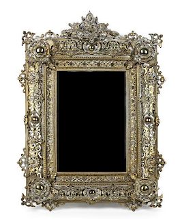 An Italian Rococo Style Metal Mirror, Height 25 x width 17 inches