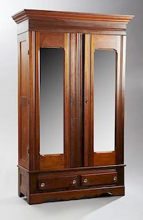 French Louis XVI Style Carved Mahogany Ormolu Mounted Armoire, 19th c., the stepped top with turned finials, above a paneled 