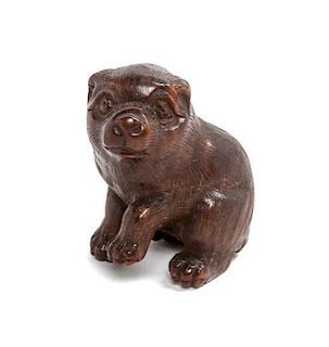 A Small Japanese Carved Wood Netsuke Height 1 1/2 inches.