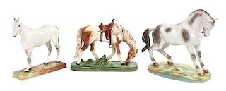 A Collection of Three Porcelain Figures Width of widest 13 1/2 inches.