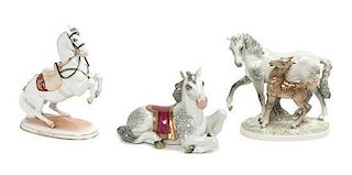 Three Continental Porcelain Horses Width of widest 9 inches.