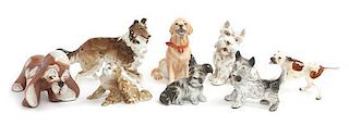 Eight Porcelain Dogs Width of widest 6 1/2 inches.