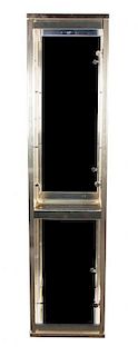 A Brass and Glass Vitrine Height 74 1/4 x width 33 x depth 13 1/2 inches.